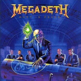 Album cover of Megadeth's Rust in Peace: Vic Rattlehead in a suit holding up a glowing green object while men in suits sit behind an alien body lying in a glass case, all in a blue hangar