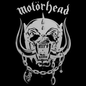 The black Motörhead album cover with the lowercase blackletter word motörhead in silver across the top above the chrome fanged skull with tusks, chains and a spiked helmet