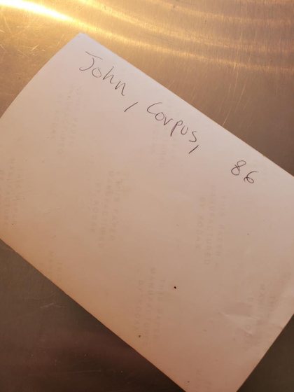 A photo envelope marked "John / Corpse ’86."