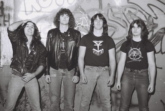 The five-piece, backstage in the mid-1980s.