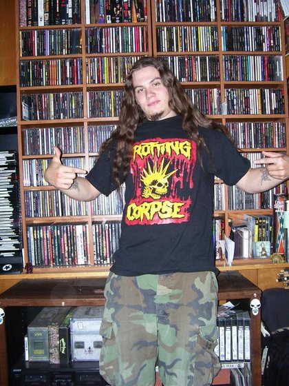 A fan’s wall, in a Rotting Corpse shirt.