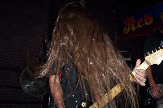 Hair down, mid-riff.
